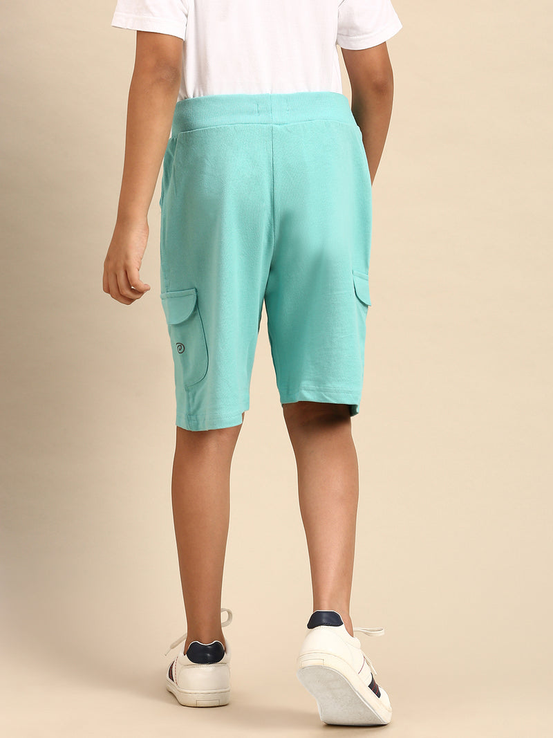 Kids - Boys Shorts Light Teal  Product Type: Shorts Pattern: Solid Color: Light Teal   Fit: Regular Fit  Product Material: Cotton Length: Knee Length  The style has a elastics and draw string closure and includes multi-pocket styling. The Shorts have a deep, solid body and are constructed in hard-wearing cotton fabric that will offer great comfort to your little one